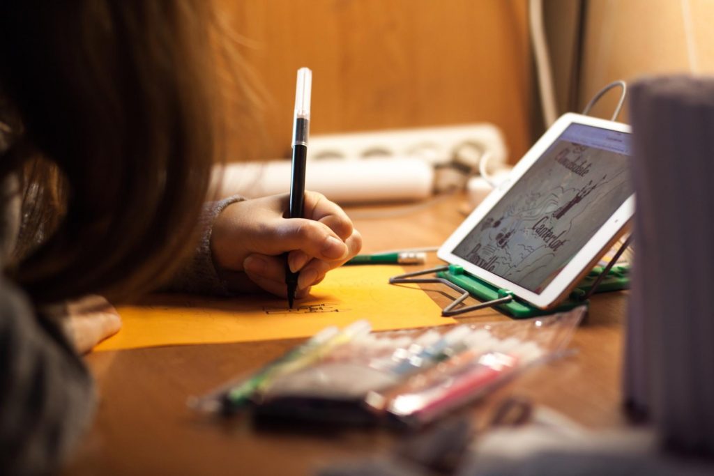 child using technology for creativity