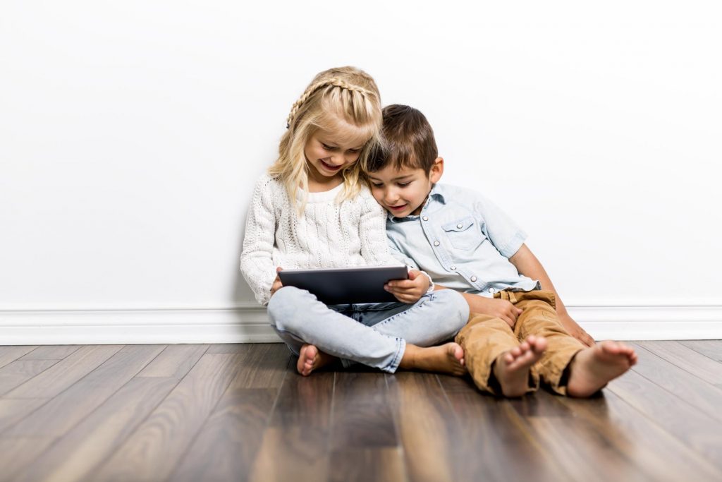 children using tablet together