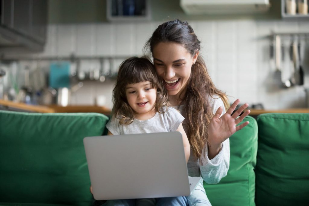 mother using technology for video chatting with young child